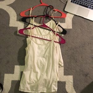 3 white tank tops